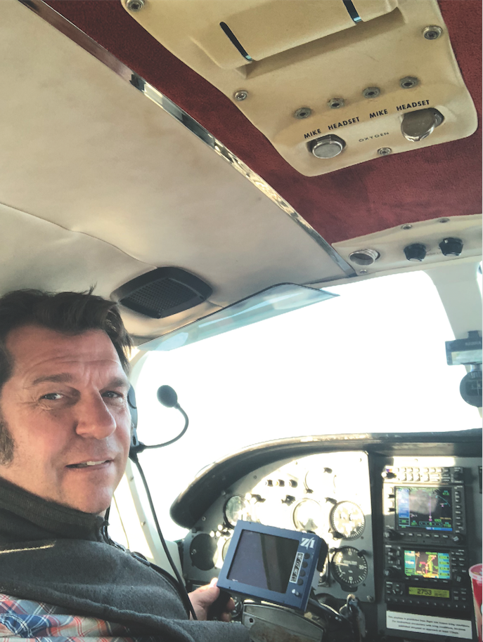 Pilot Mark Schubert at the controls.